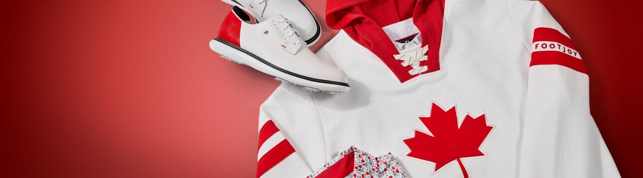 INTRODUCING THE NEW CANADA COLLECTION. HOCKEY INSPIRED GOLF HOODIE ON RED BACKDROP.